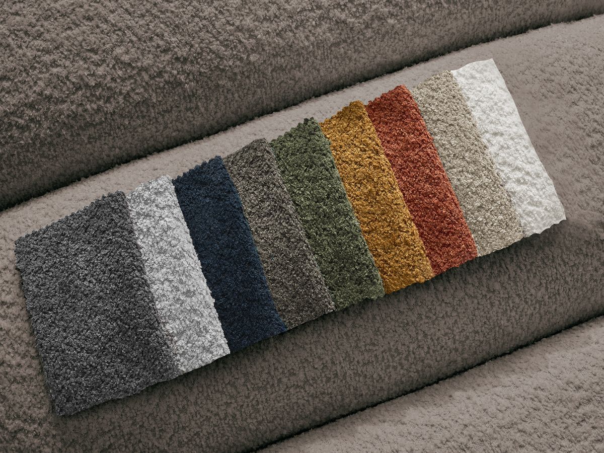 Canapé d'angle fixe TALIA tissu bouclette avec pouf