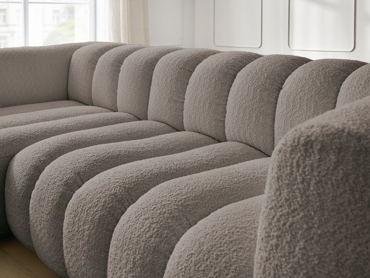 Canapé d'angle fixe TALIA tissu bouclette avec pouf