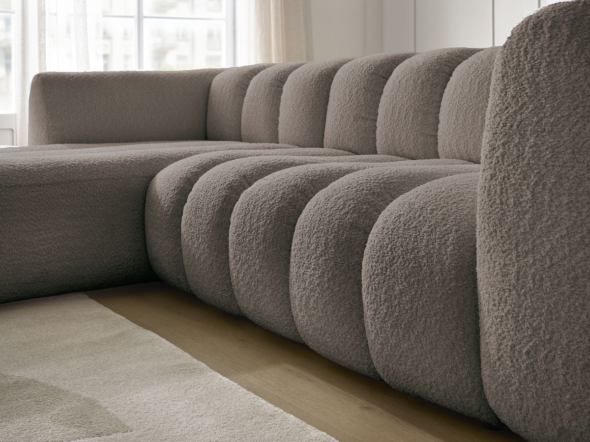 Canapé d'angle fixe TALIA tissu bouclette avec pouf