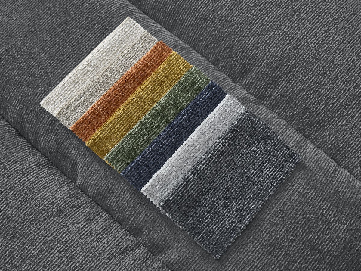 Canapé d'angle fixe SIERRA tissu texturé avec pouf