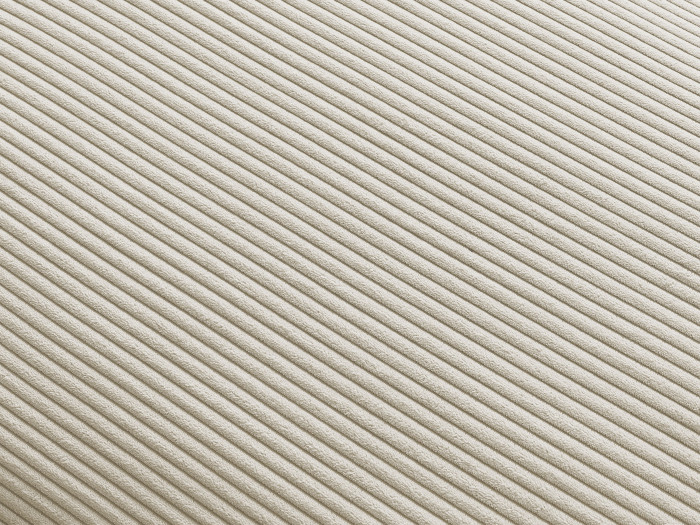 Gros plan du tissu côtelé beige du canapé Paris.