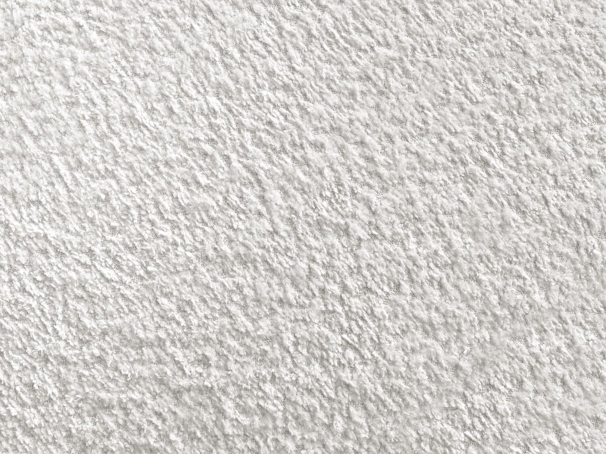 Canapé d'angle L convertible FUJI tissu bouclette avec pouf