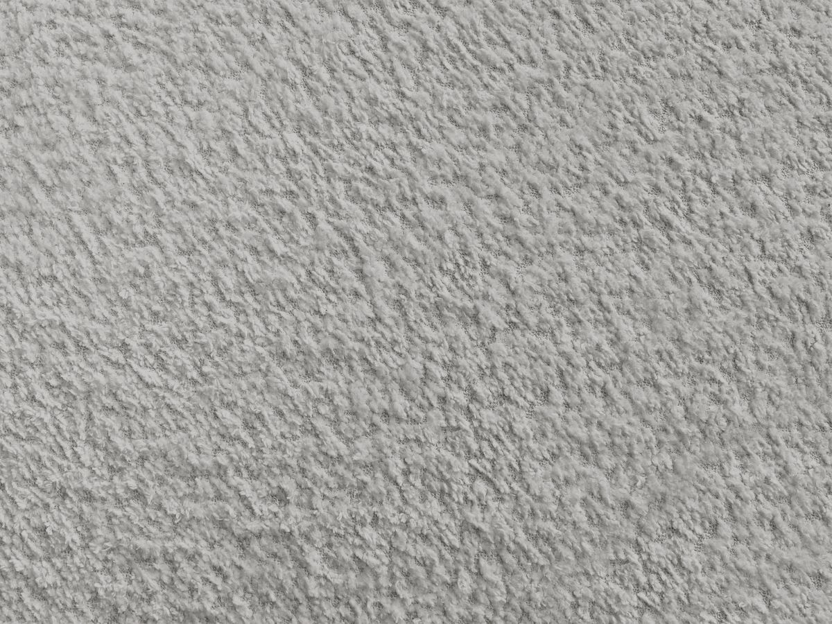 Canapé d'angle L convertible FUJI tissu bouclette avec pouf