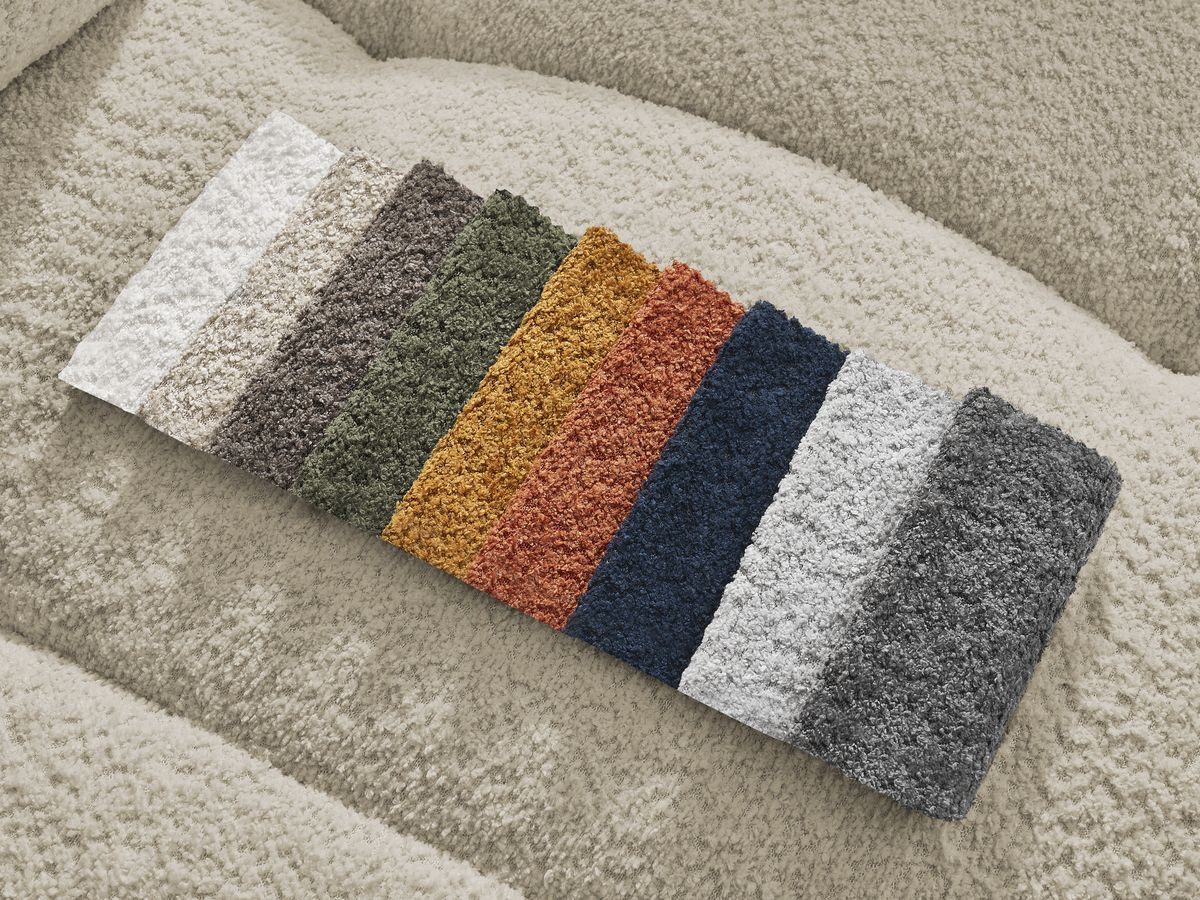 Canapé d'angle convertible coffre ROXELANE tissu bouclette avec pouf