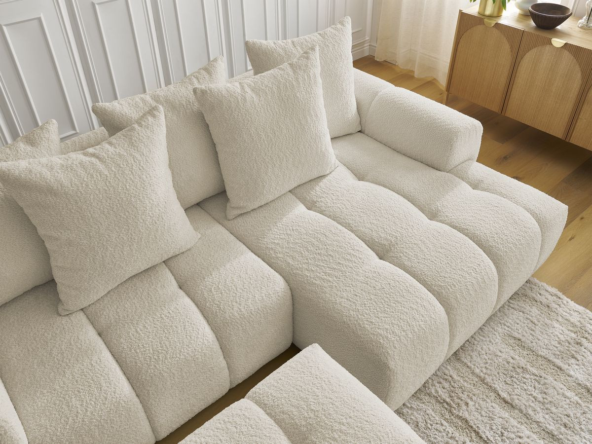 Canapé d'angle convertible coffre ROXELANE tissu bouclette avec pouf