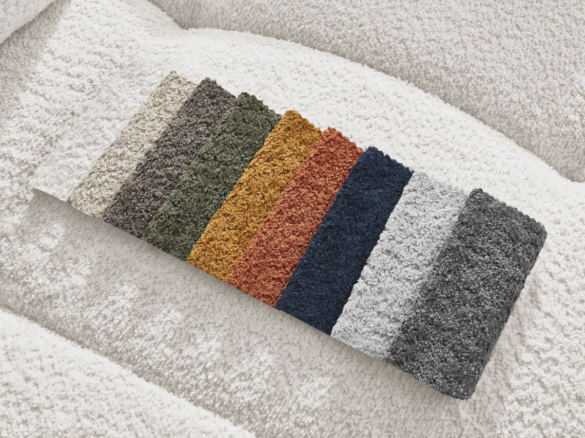 Canapé d'angle convertible coffre ROXELANE tissu bouclette avec pouf