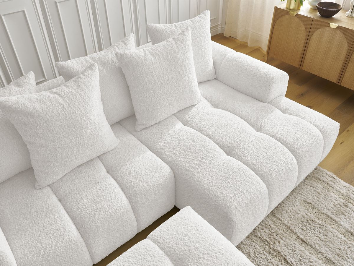 Canapé d'angle convertible coffre ROXELANE tissu bouclette avec pouf