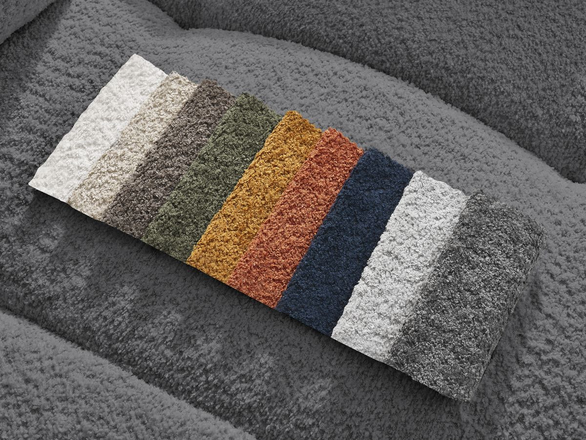 Canapé d'angle convertible coffre ROXELANE tissu bouclette avec pouf