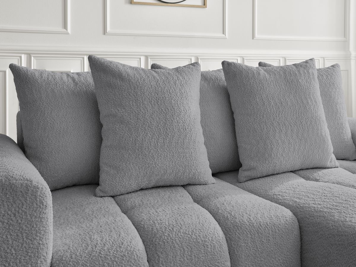 Canapé d'angle convertible coffre ROXELANE tissu bouclette avec pouf