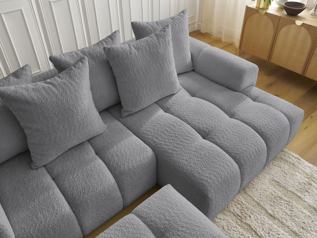 Canapé d'angle convertible coffre ROXELANE tissu bouclette avec pouf