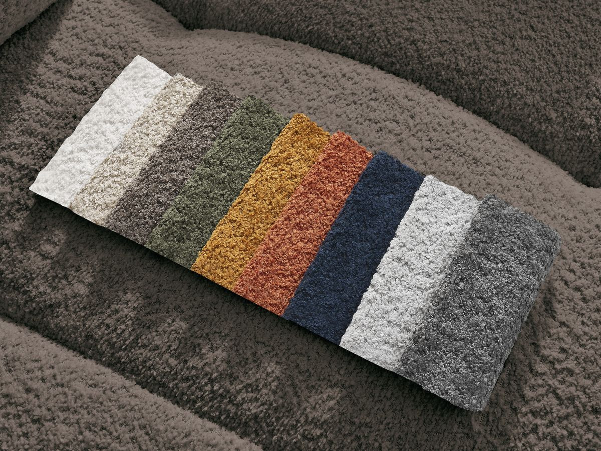 Canapé d'angle convertible coffre ROXELANE tissu bouclette avec pouf