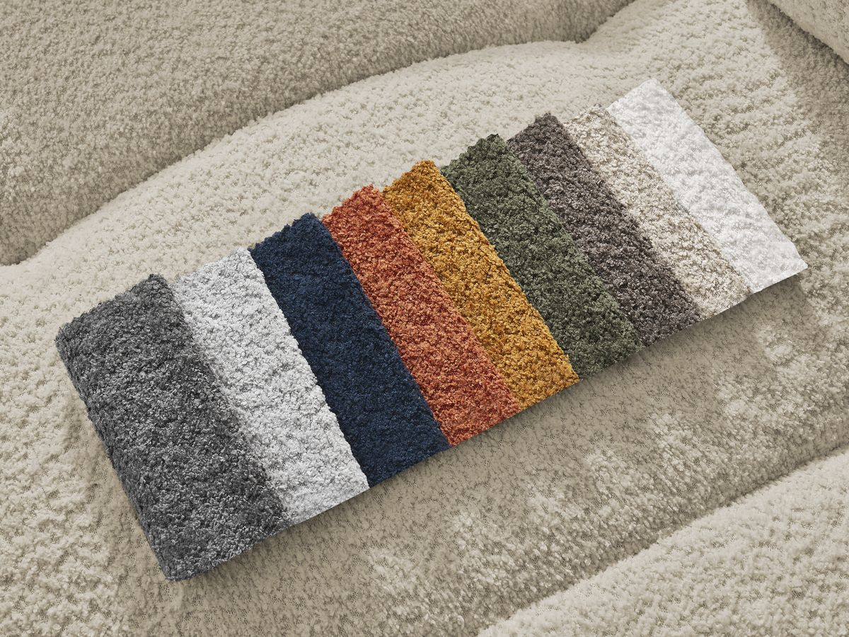 Canapé d'angle convertible coffre ROXELANE tissu bouclette avec pouf