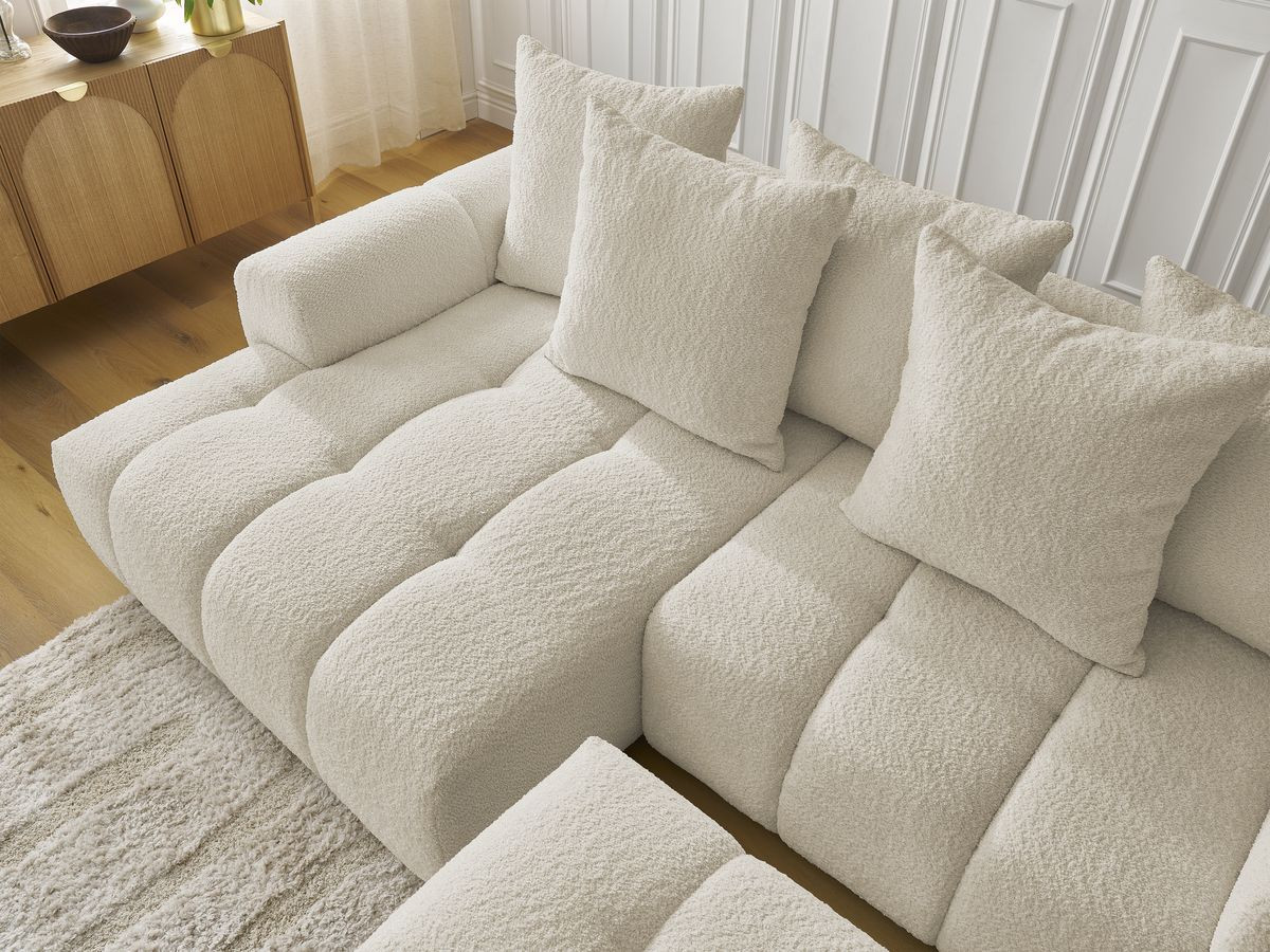 Canapé d'angle convertible coffre ROXELANE tissu bouclette avec pouf