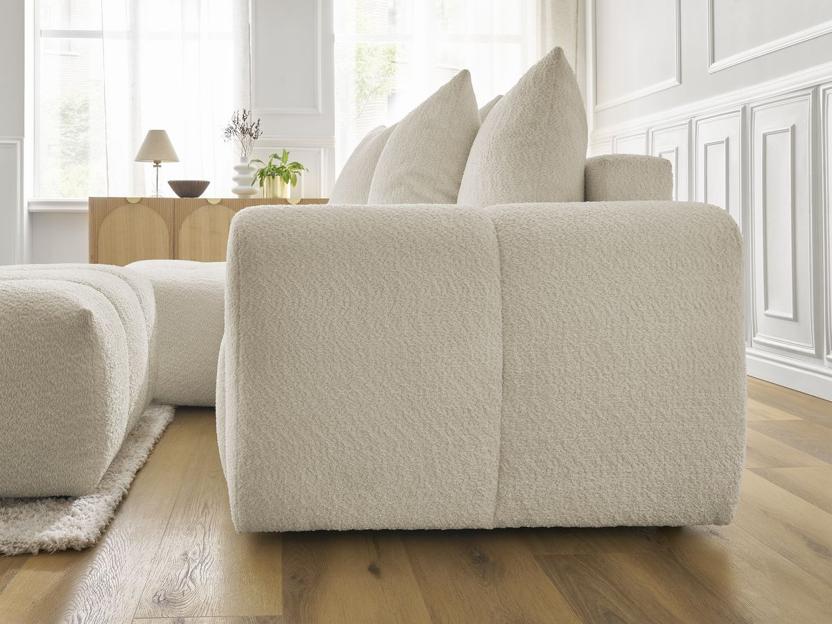 Canapé d'angle convertible coffre ROXELANE tissu bouclette avec pouf