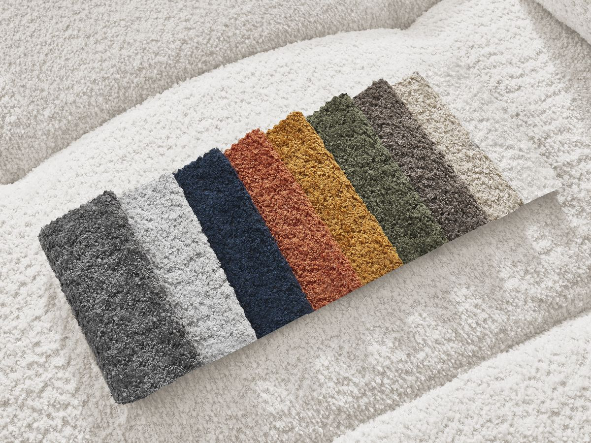 Canapé d'angle convertible coffre ROXELANE tissu bouclette avec pouf