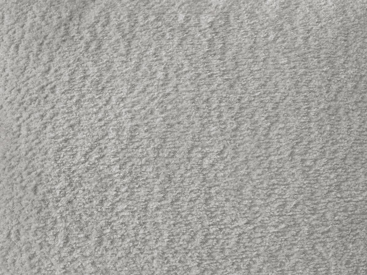 Canapé d'angle convertible coffre ROXELANE tissu bouclette avec pouf