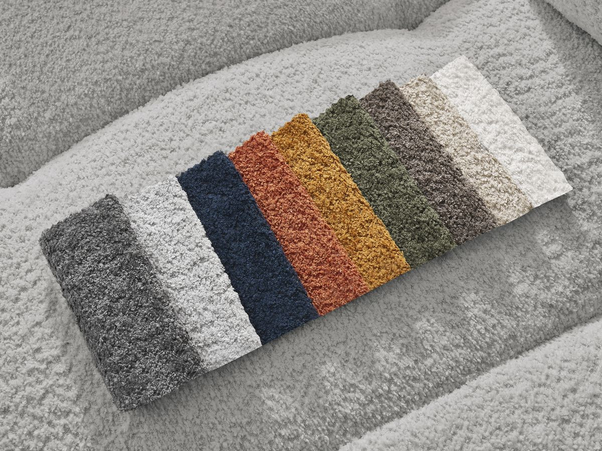 Canapé d'angle convertible coffre ROXELANE tissu bouclette avec pouf