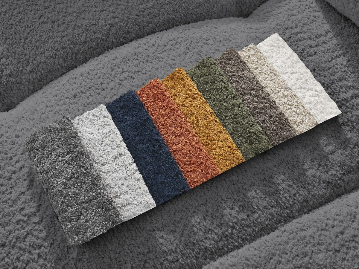 Canapé d'angle convertible coffre ROXELANE tissu bouclette avec pouf