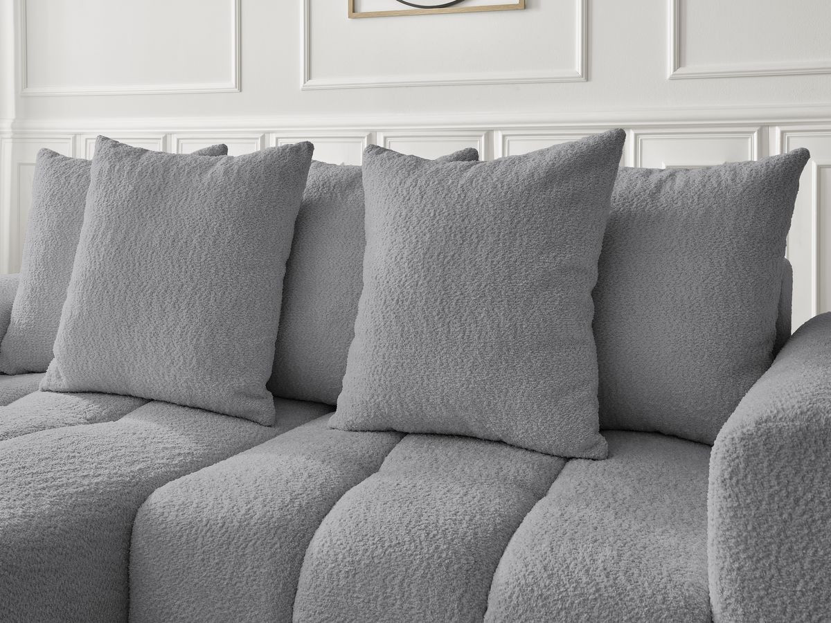 Canapé d'angle convertible coffre ROXELANE tissu bouclette avec pouf