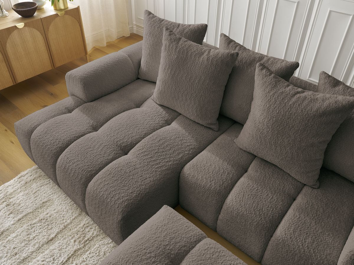 Canapé d'angle convertible coffre ROXELANE tissu bouclette avec pouf
