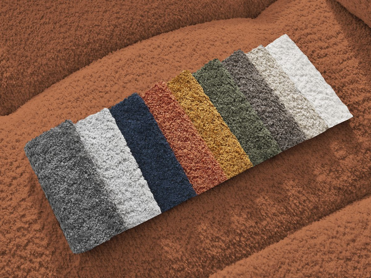 Canapé d'angle convertible coffre ROXELANE tissu bouclette avec pouf
