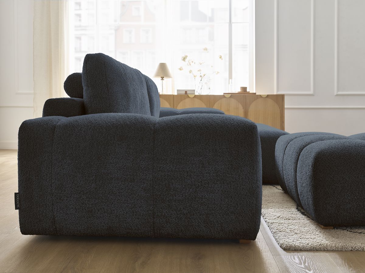 Canapé d'angle réversible ANAKIN tissu bouclette avec pouf