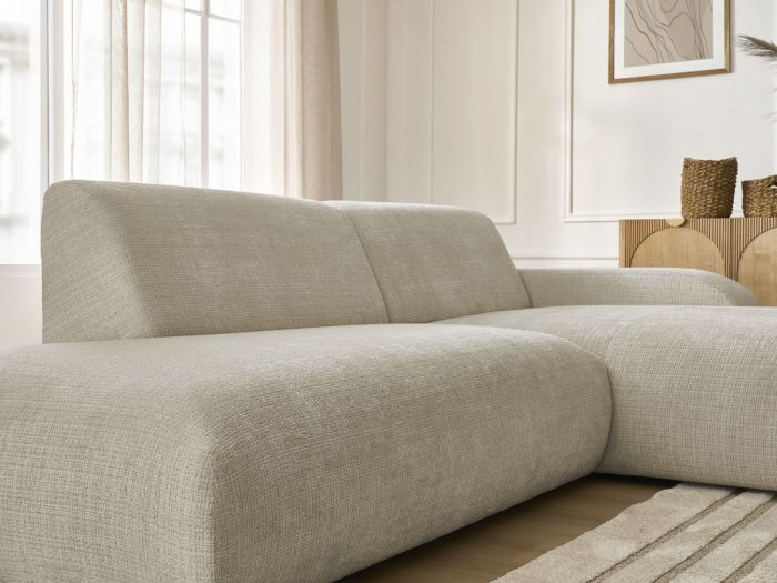 Canapé Sirius modulable beige clair vu de face, modules arrondis, coussins distincts visibles