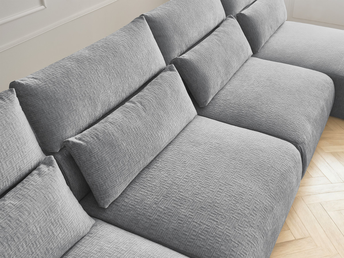 Modulaire vaste panoramabank met hoofdsteunen in JANA-stof met 2 chaise longues, 2 fauteuils en 1 grote poef