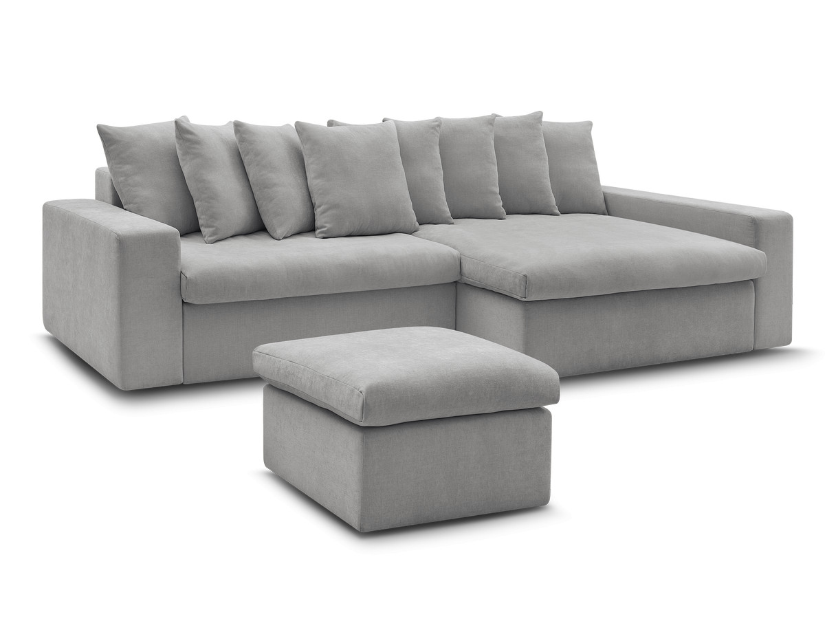 enore vaste hoekbank in gladde stof met voetenbank gekleurd lichtgrijs