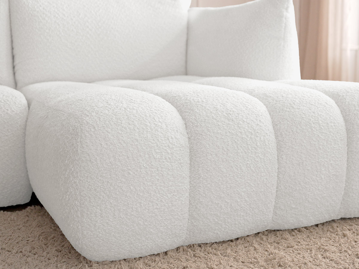Canapé d'angle fixe modulable AZRA tissu bouclette avec pouf