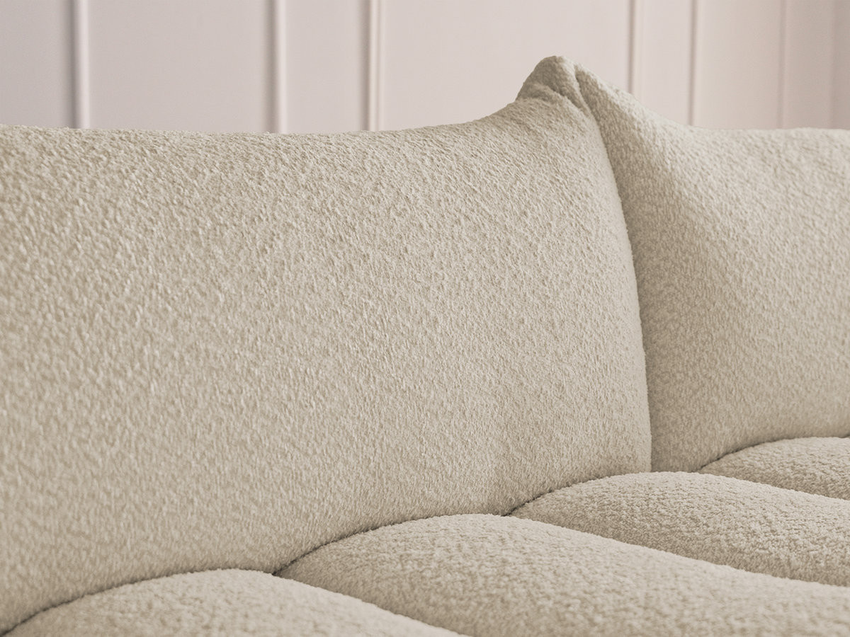 Canapé d'angle fixe modulable AZRA tissu bouclette avec pouf