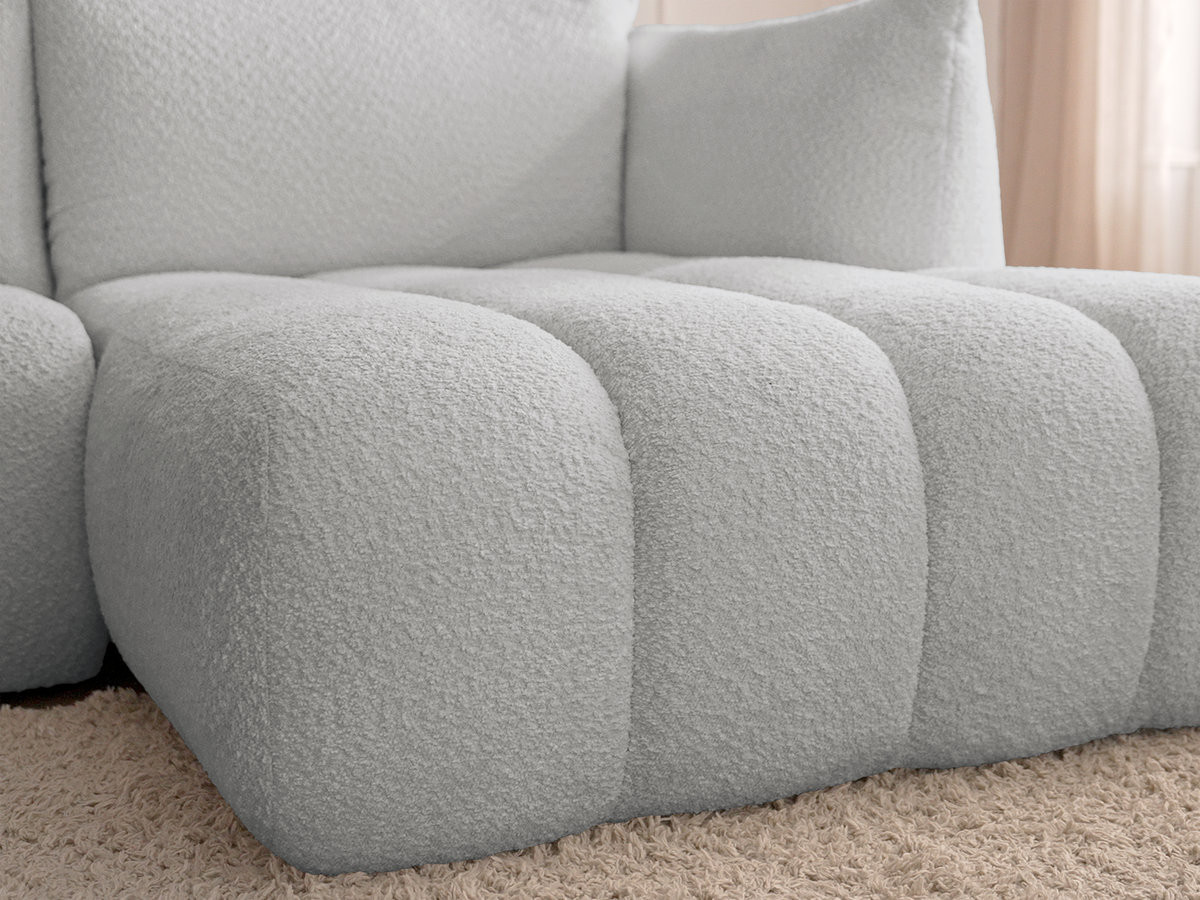 Canapé d'angle fixe modulable AZRA tissu bouclette avec pouf