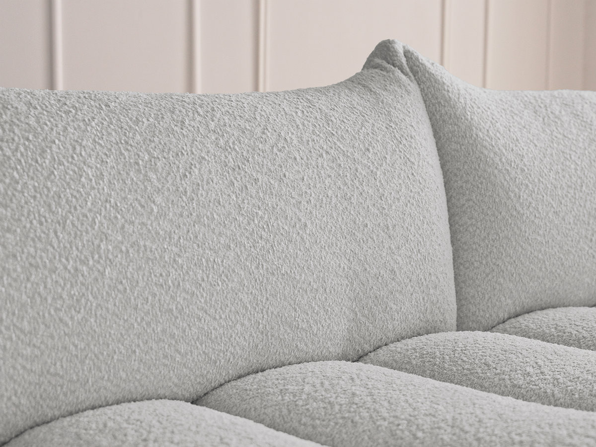 Canapé d'angle fixe modulable AZRA tissu bouclette avec pouf