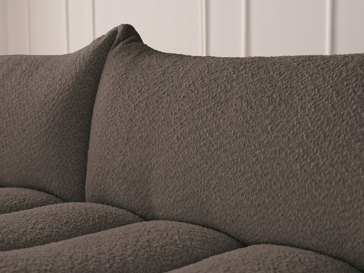 Canapé d'angle fixe modulable AZRA tissu bouclette avec pouf