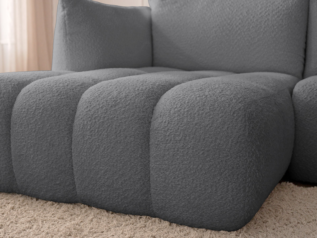 Canapé d'angle fixe modulable AZRA tissu bouclette avec pouf