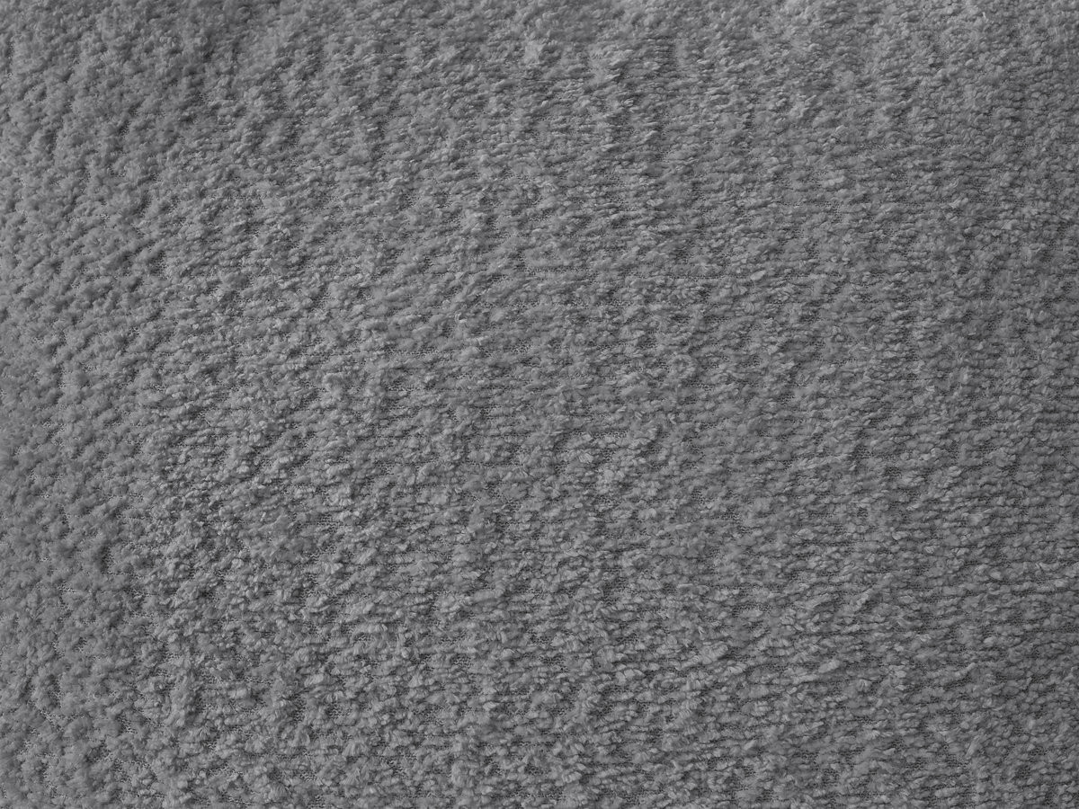 Canapé d'angle fixe modulable AZRA tissu bouclette avec pouf