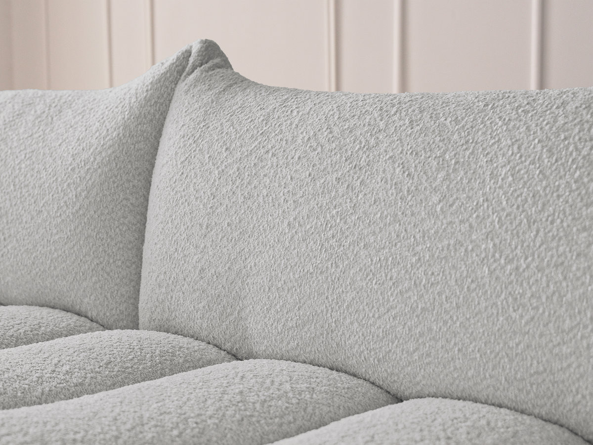 Canapé d'angle fixe AZRA tissu bouclette avec pouf