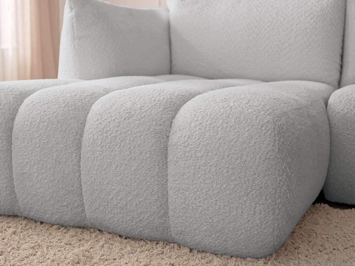 Canapé d'angle fixe AZRA tissu bouclette avec pouf