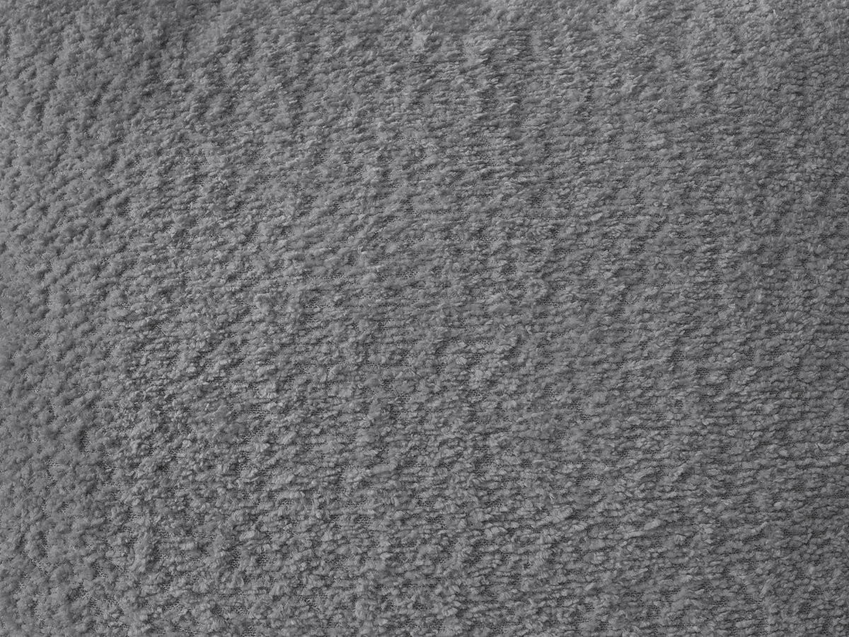 Canapé d'angle convertible coffre MONTAIGNE tissu bouclette avec pouf