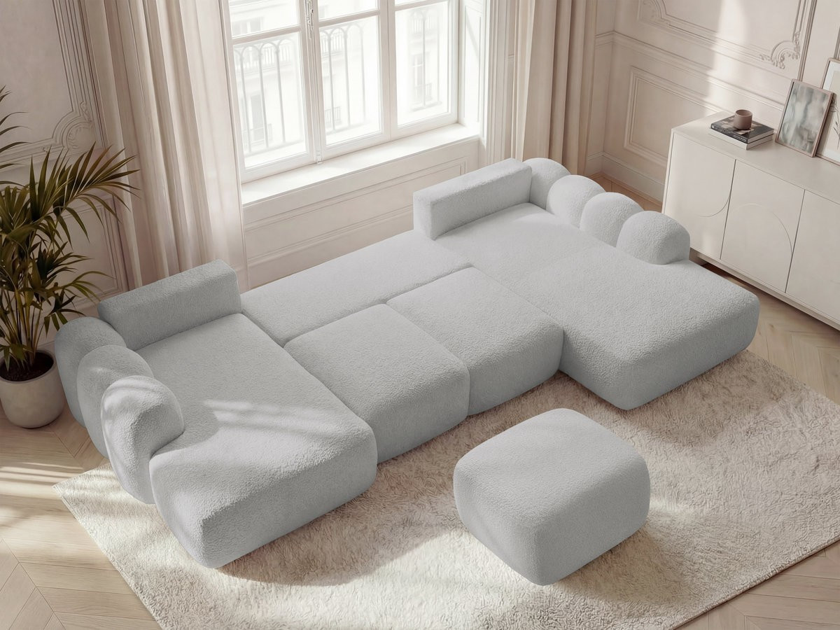 MONTAIGNE panoramische slaapbank met opbergruimte, bouclé stof en voetenbank.