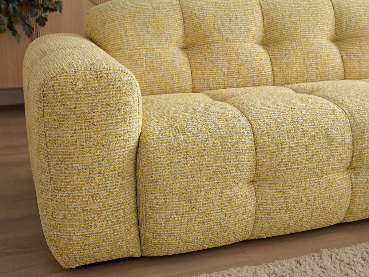 LAURA vaste hoekbank in gem?leerde stof met grote voetenbank