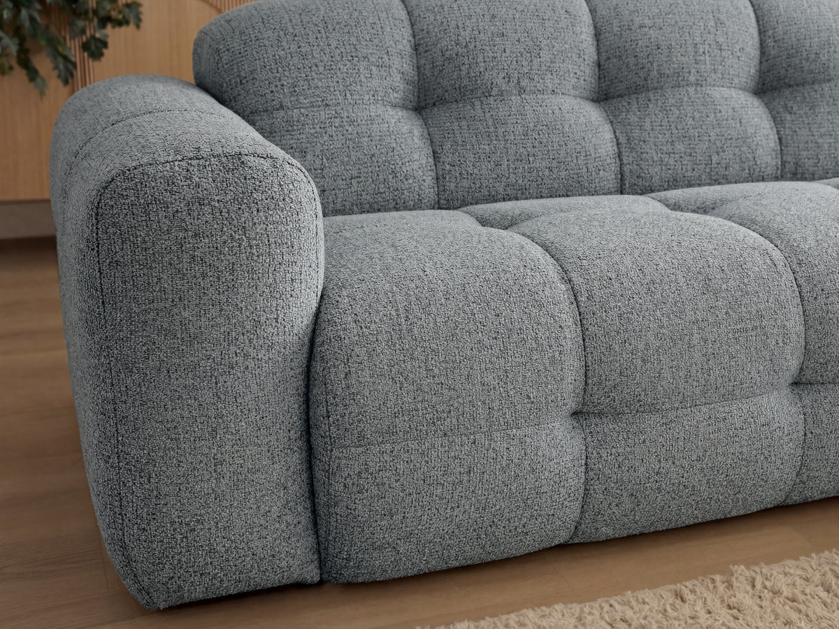 Canapé d'angle fixe LAURA tissu chiné avec grand pouf