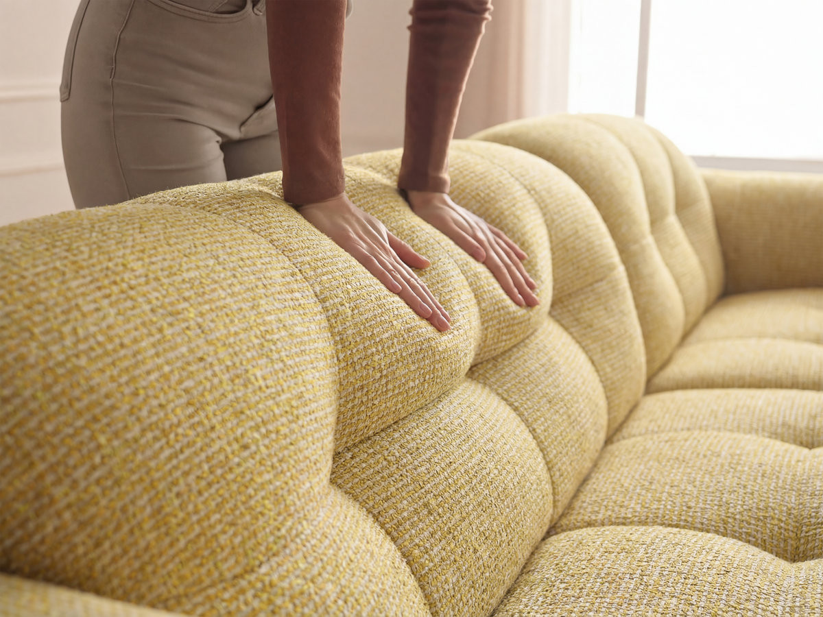 LAURA vaste hoekbank in gem?leerde stof met grote voetenbank