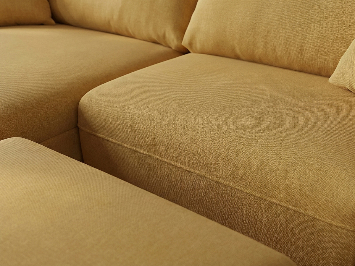 Canapé d'angle fixe LUIGI tissu lisse avec pouf