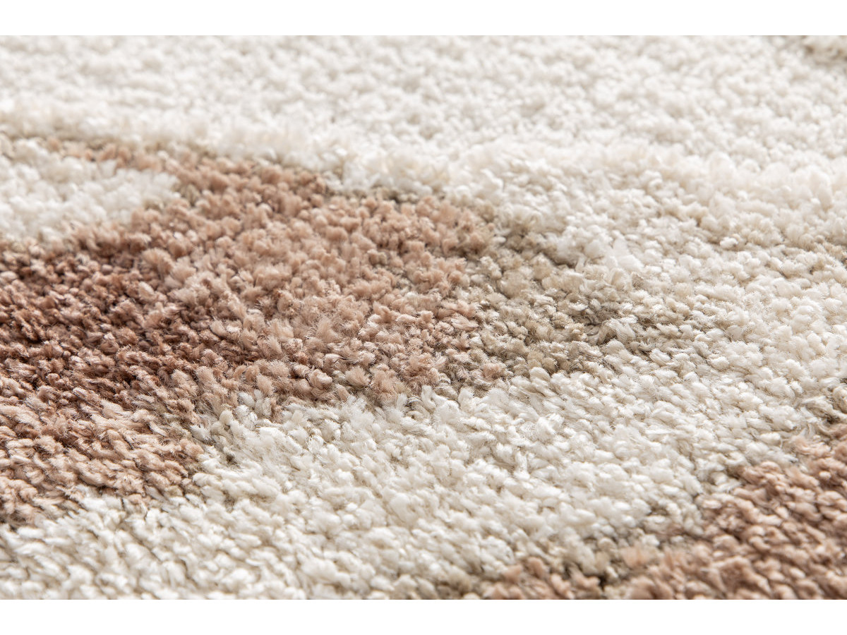 Tapis rond poils longs LECHE motif abstrait