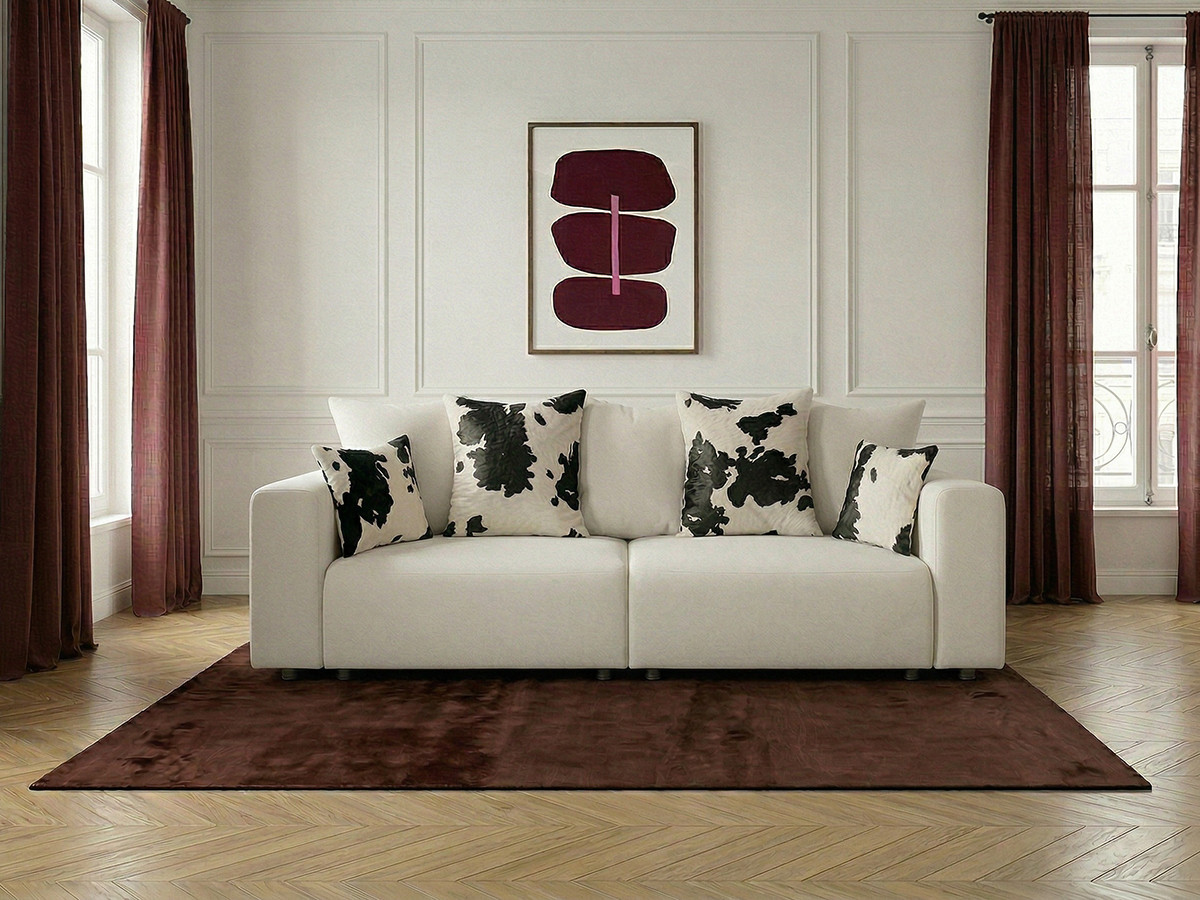 Canapé droit convertible SIDONIE avec coussins à motif vache
