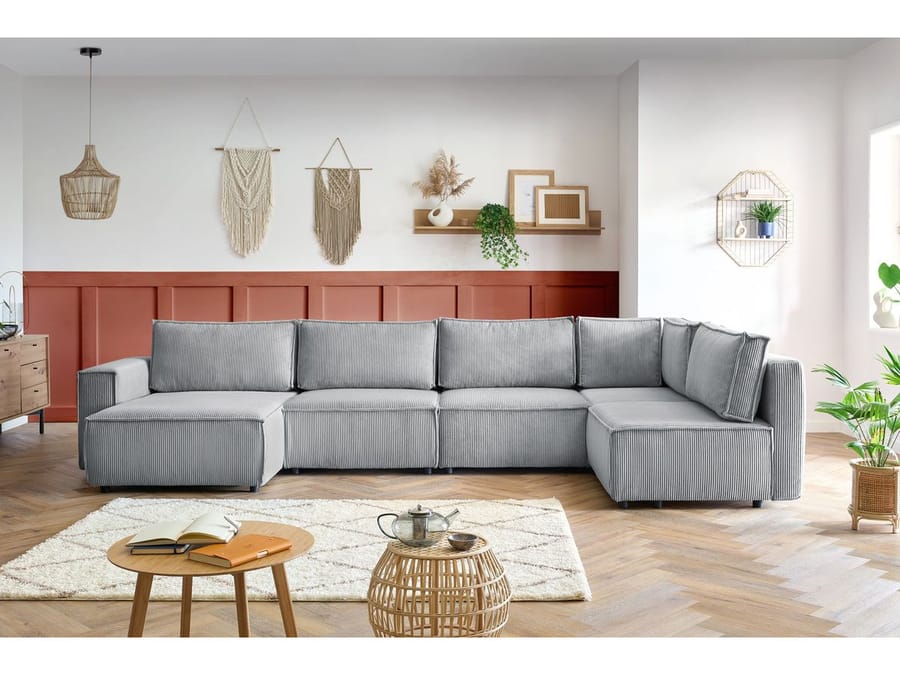 Canapé Nihad gris modulable avec méridienne dans un salon scandinave contemporain.