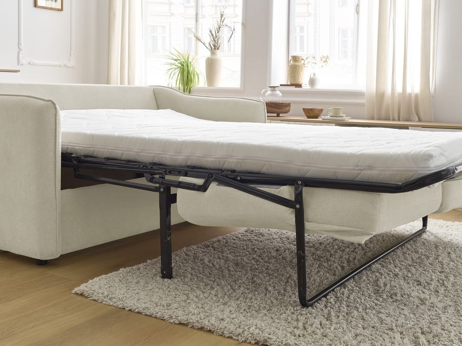 Mécanisme du canapé Lenny convertible déplie montrant la structure de lit.