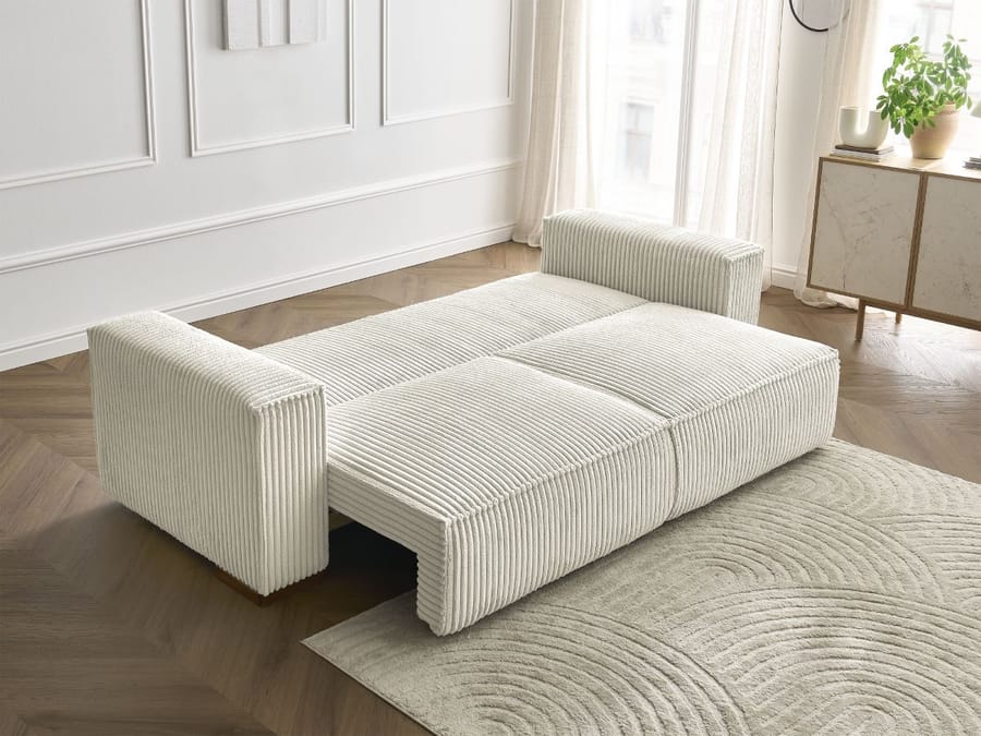 Canapé Chelsea blanc convertible en position lit avec matelas déplié et visible