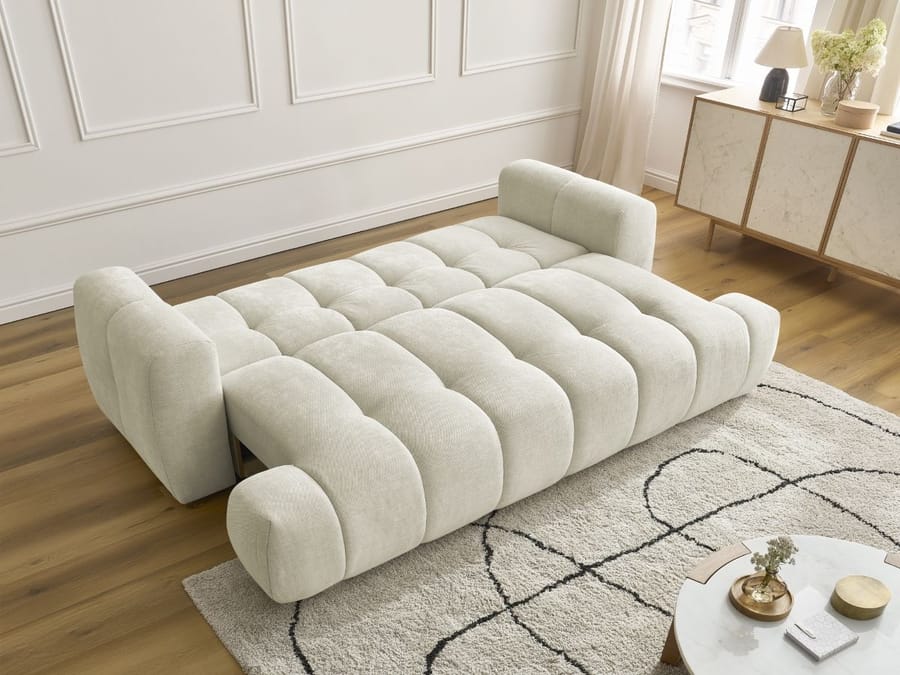 Canapé Fuji beige en position lit convertible avec matelas déplié visible.